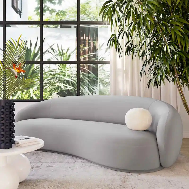 Canapé en velours avec silhouette incurvée et revêtement moelleux