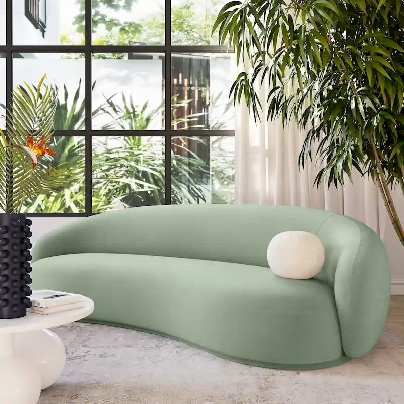 Canapé en velours avec silhouette incurvée et revêtement moelleux