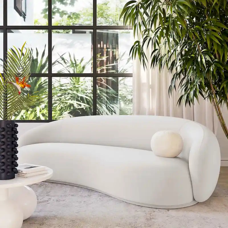 Canapé en velours avec silhouette incurvée et revêtement moelleux