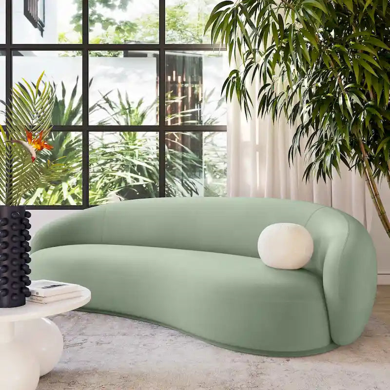 Canapé en velours avec silhouette incurvée et revêtement moelleux